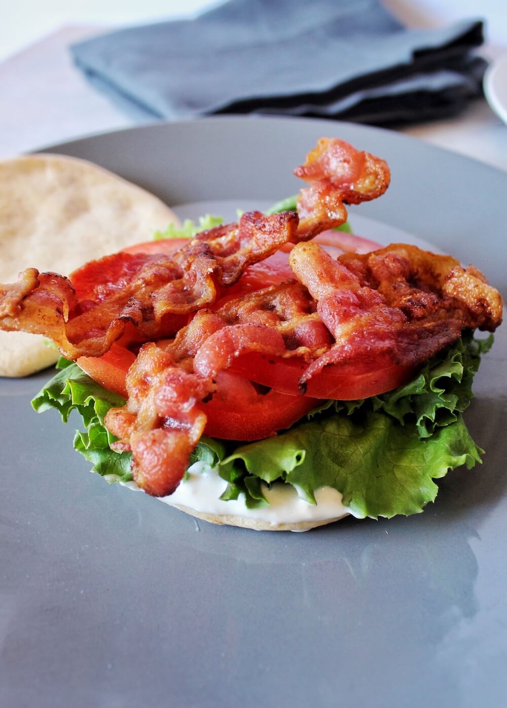 Perfectly cooked bacon atop Keto cloud bread makes this delicious BLT sandwich.