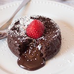 Delicious Keto Lava Cake with a molten center topped with a strawberry