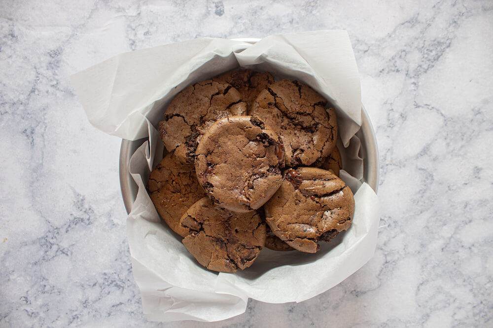 Finished keto cookies in a tin ready for storing.